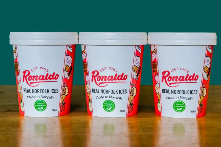 Three Ronaldo ice cream tubs on wooden table