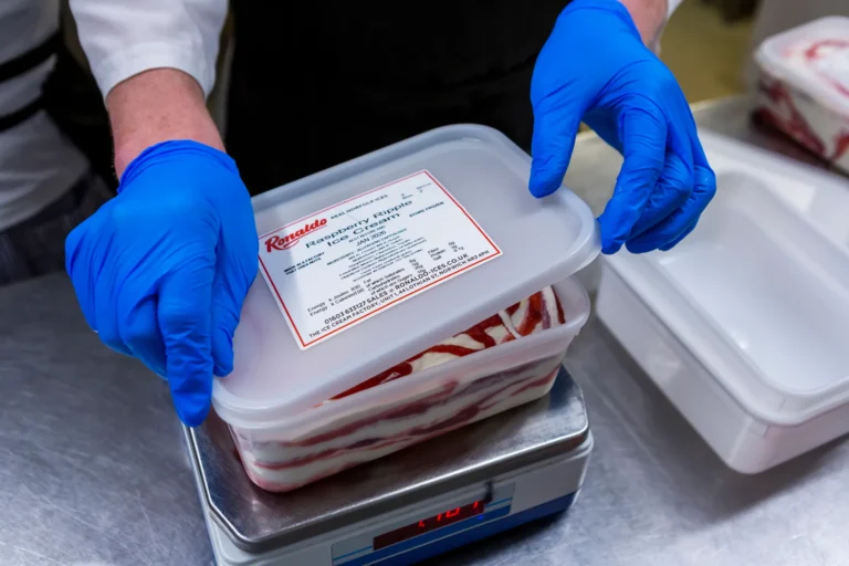 Person weighing Raspberry Ripple ice cream on scale.
